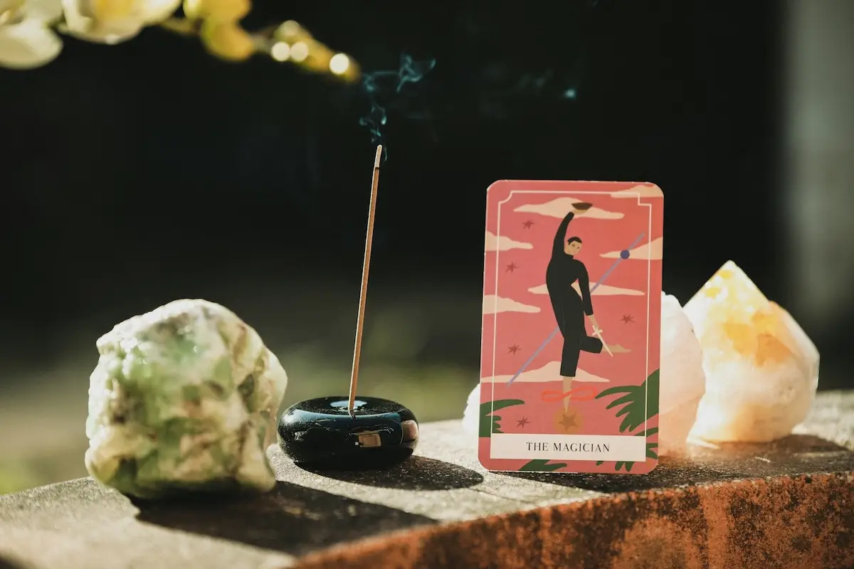 the magician tarot card meaning incense burning large crystals